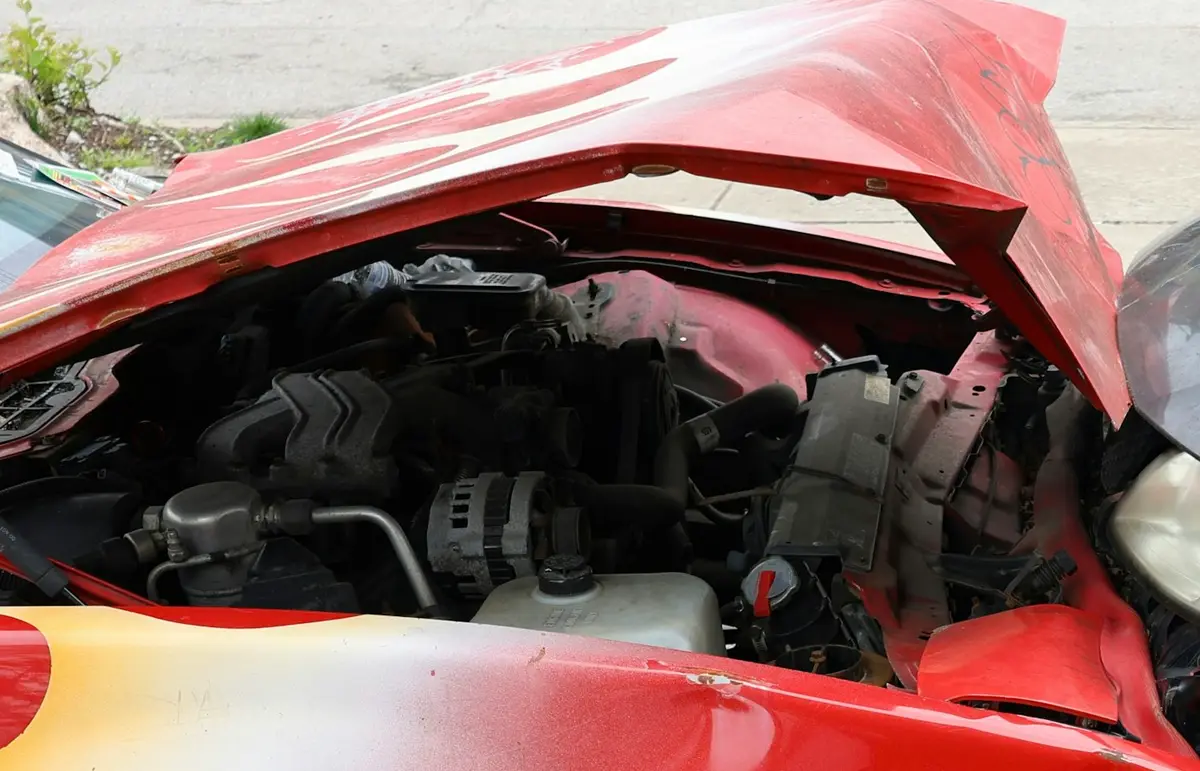 Crumpled hood of a car damaged in a collision