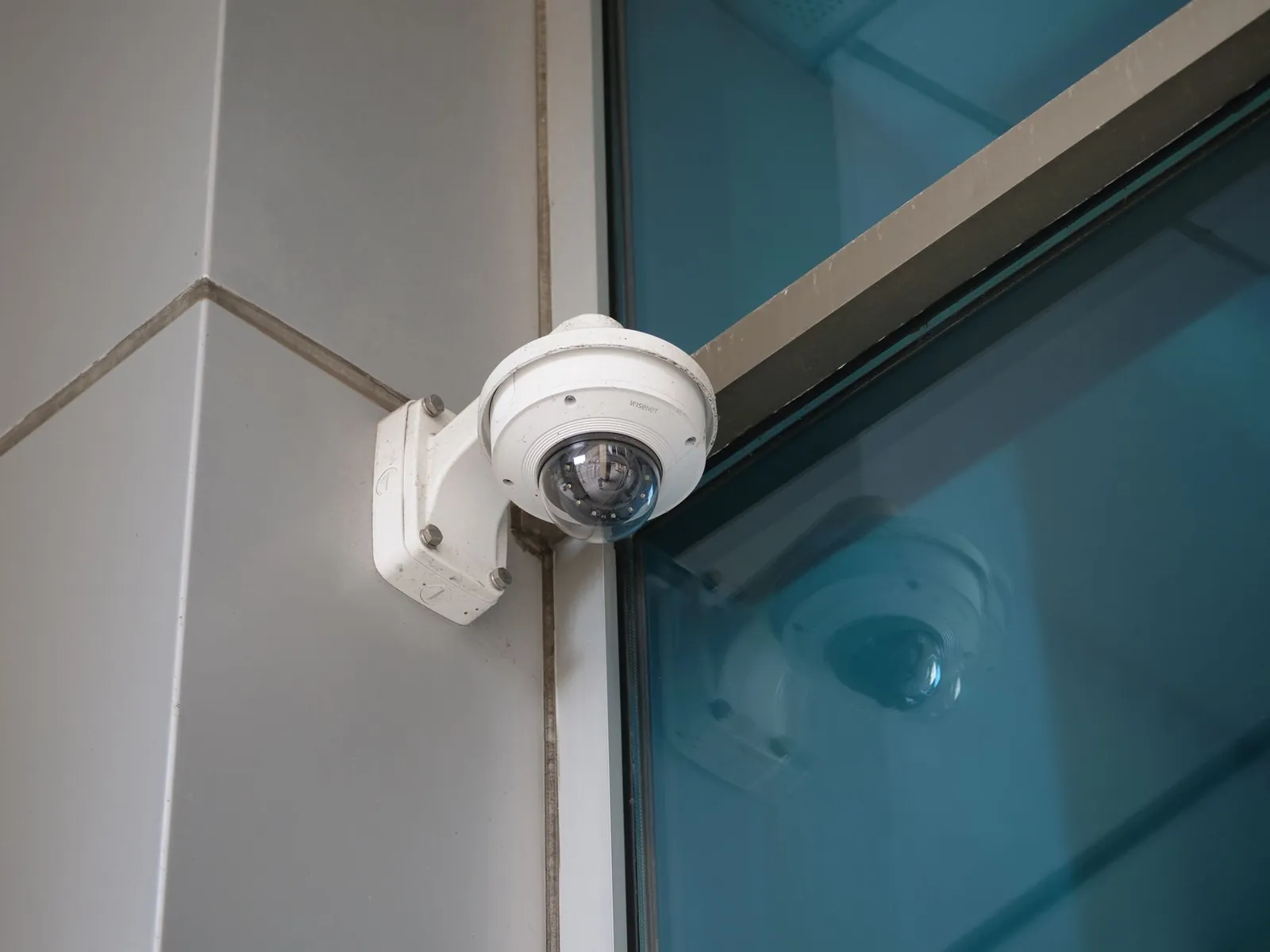 Security camera mounted on the corner of a commercial building