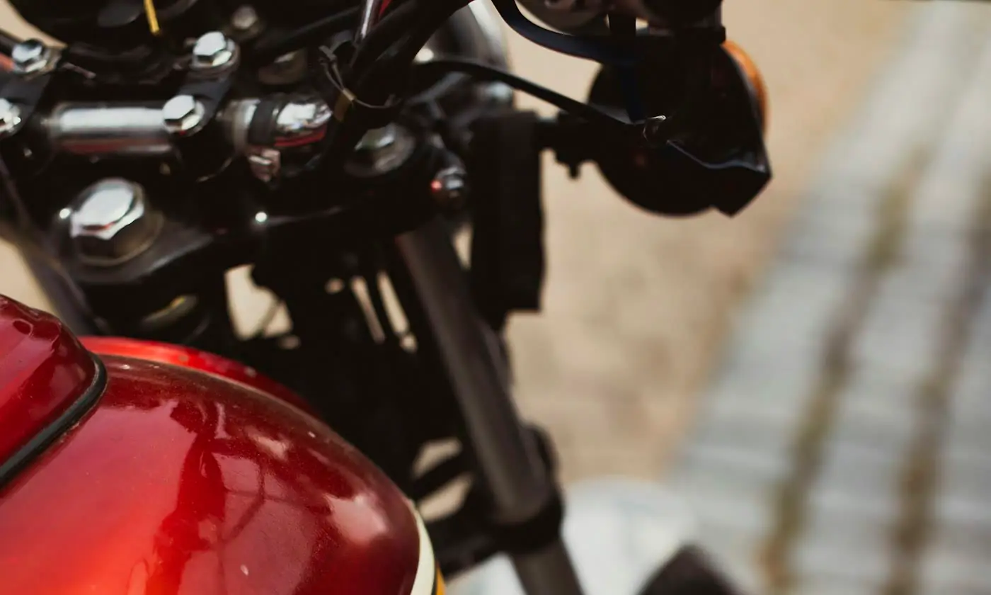 Close view of a motorcycle parked along a city street