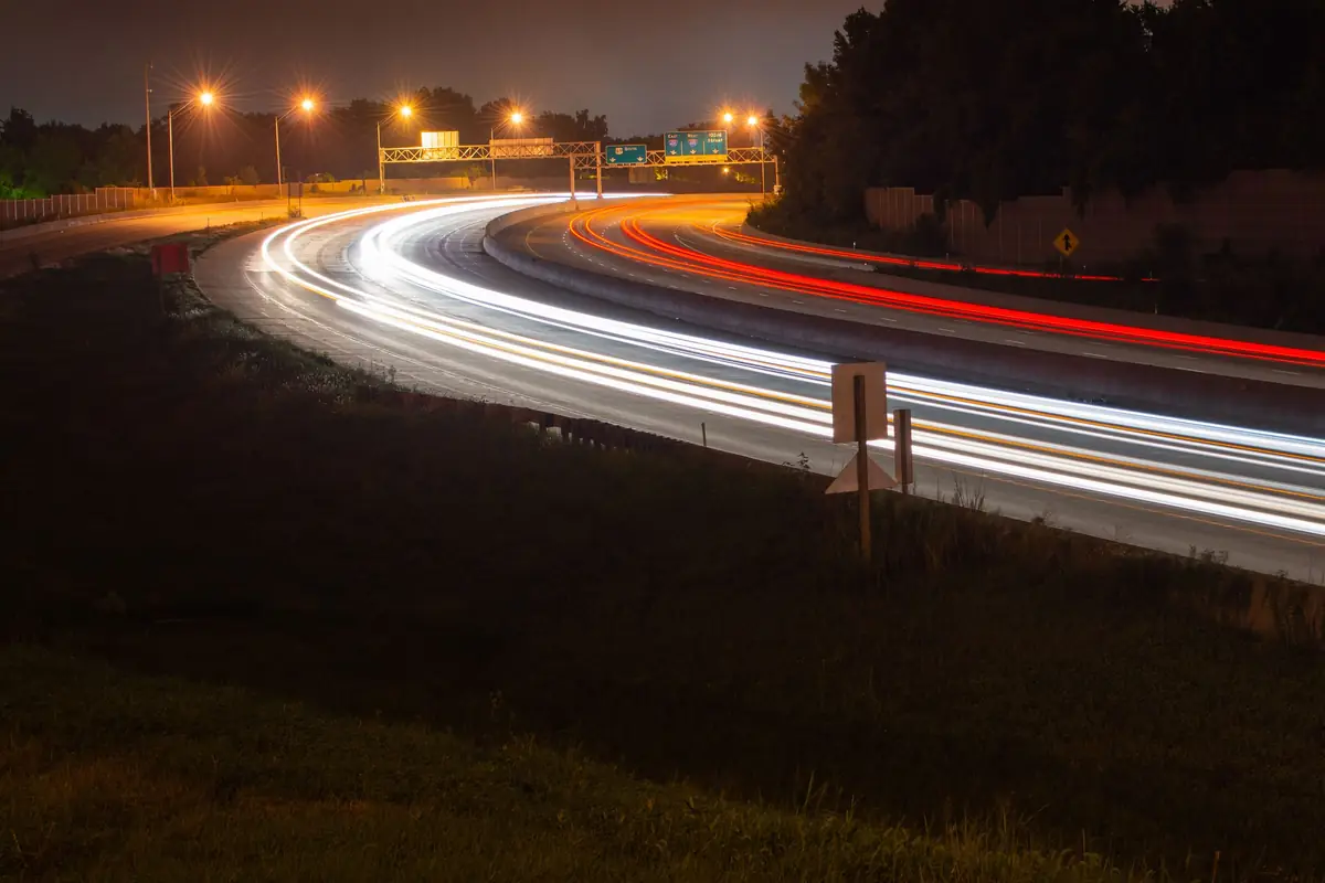 Light trails from traffic on a highway at night