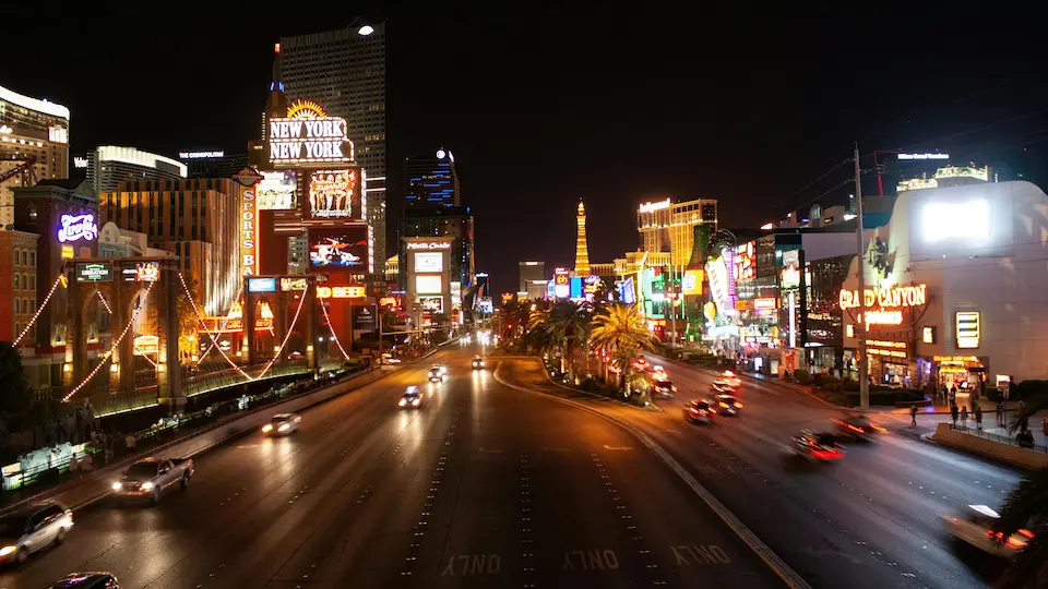 Busy Las Vegas intersection at night where comparative negligence may apply after a multi-vehicle accident