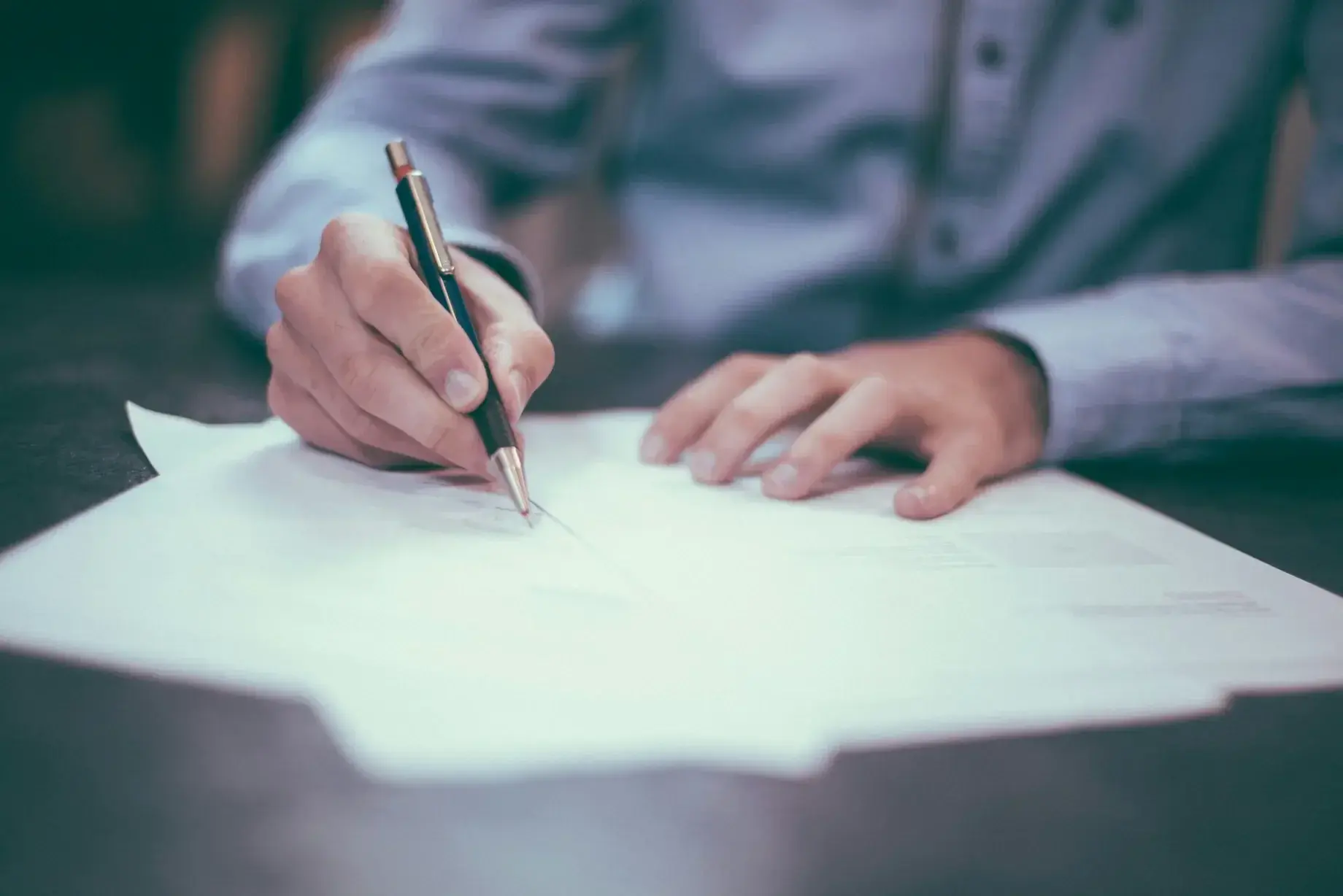 Business owner reviewing LLC formation documents at a desk